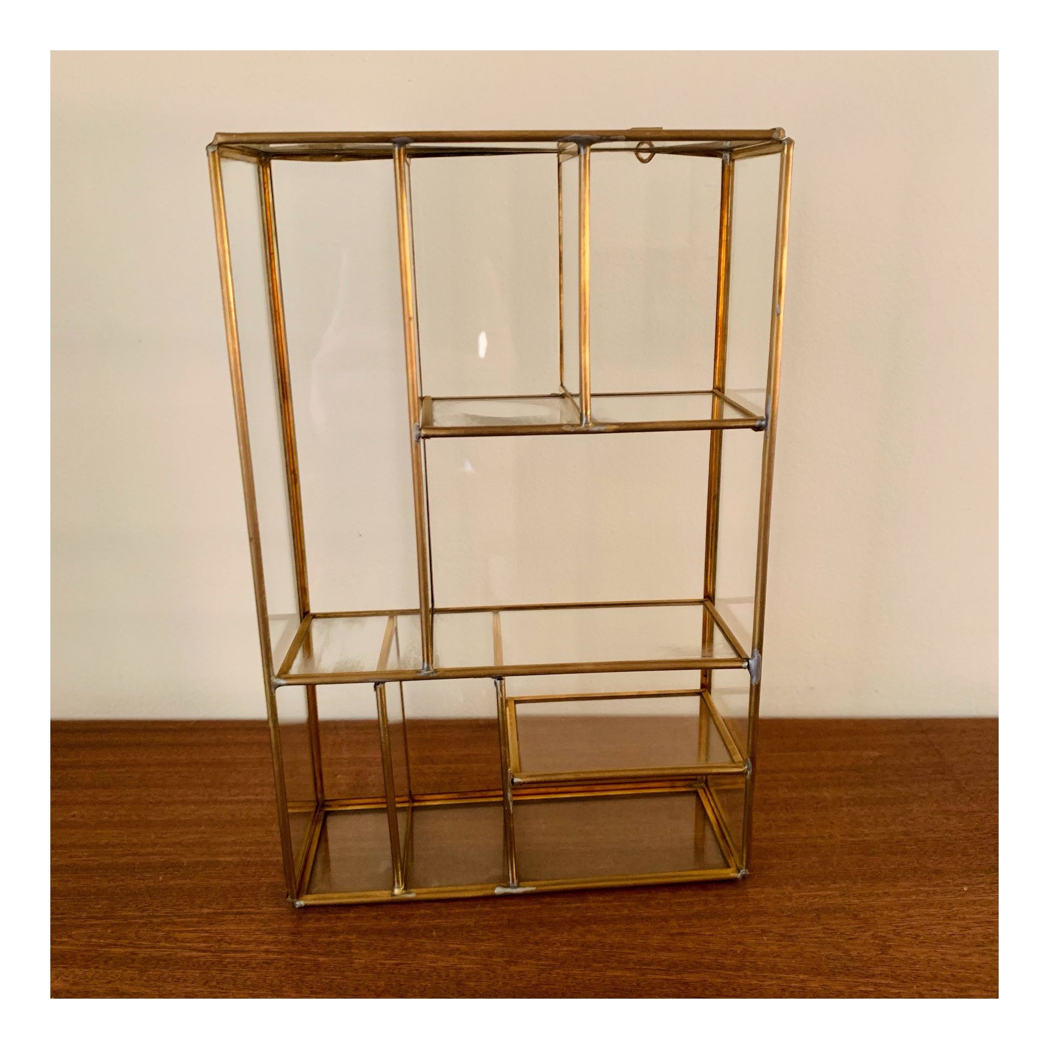 Miniature showcase in glass and gilded metal