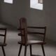 Pair of Scandinavian wooden armchairs with hand-carved folk motifs, 1920s.