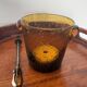 Amber bubble glass ice bucket signed Biot, with its tongs.