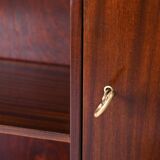 Vintage bookshelf with a door