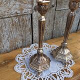 Pair of chiseled metal candle holders