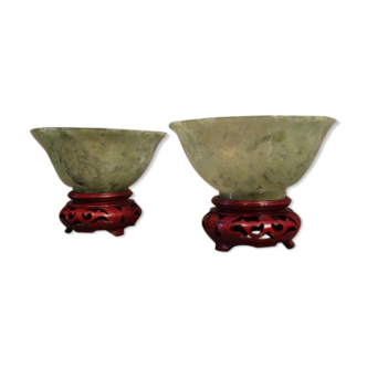 Pair of jade bowls on carved wood base far east China