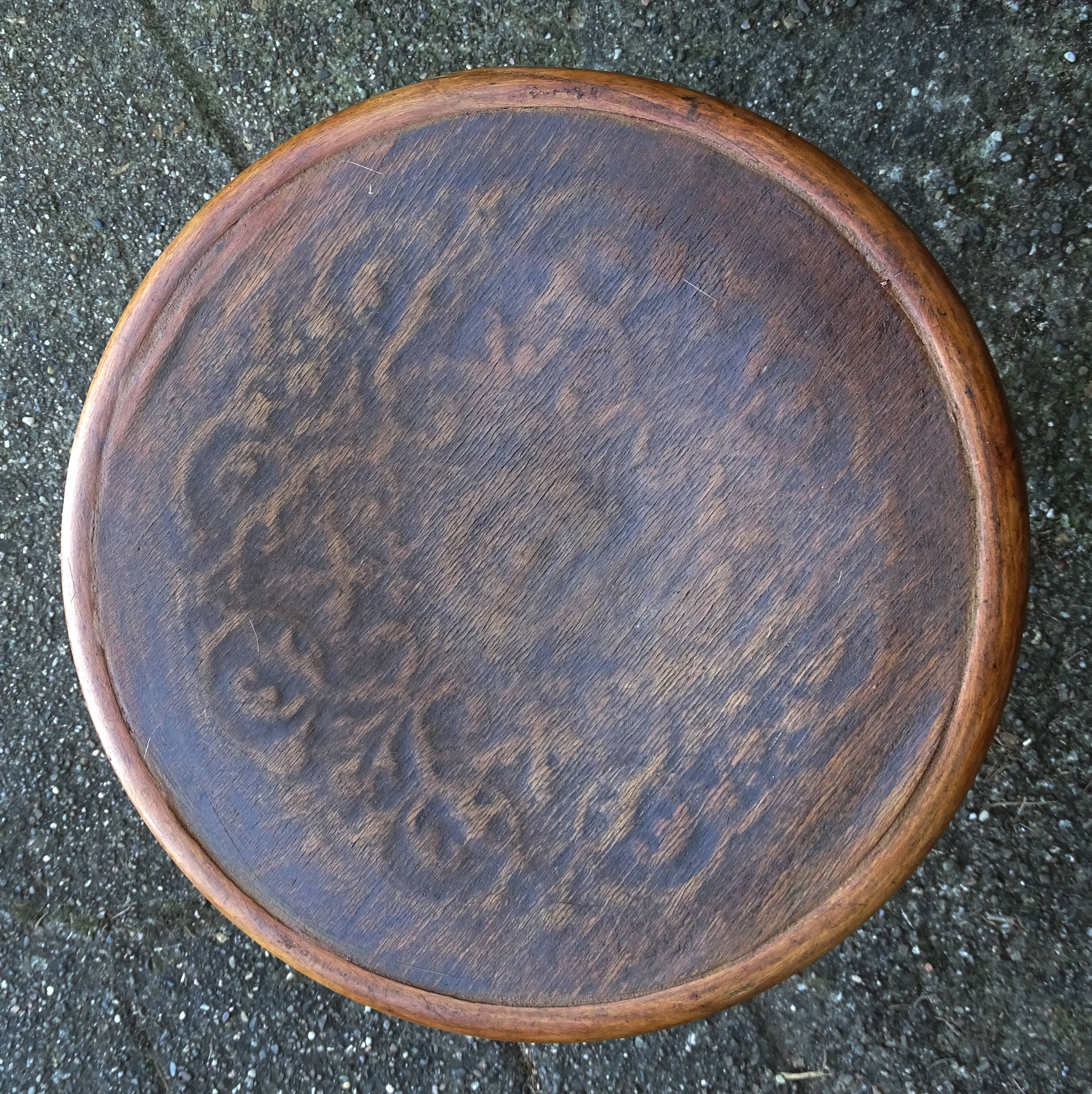 Low stool with wooden seat, circa 1930