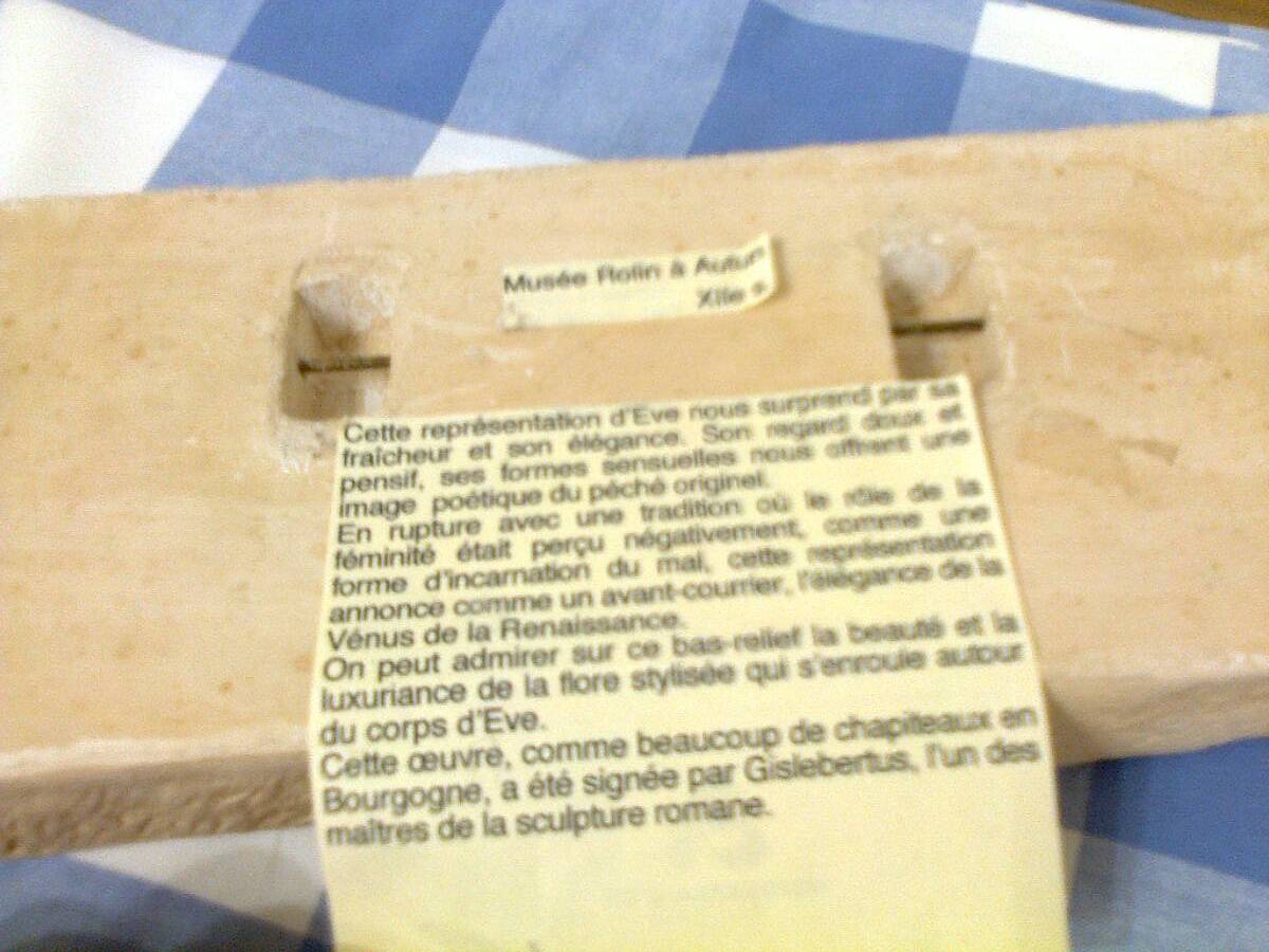 Sculpted stone wall decoration, medieval motif: Eve in the Garden of Eden