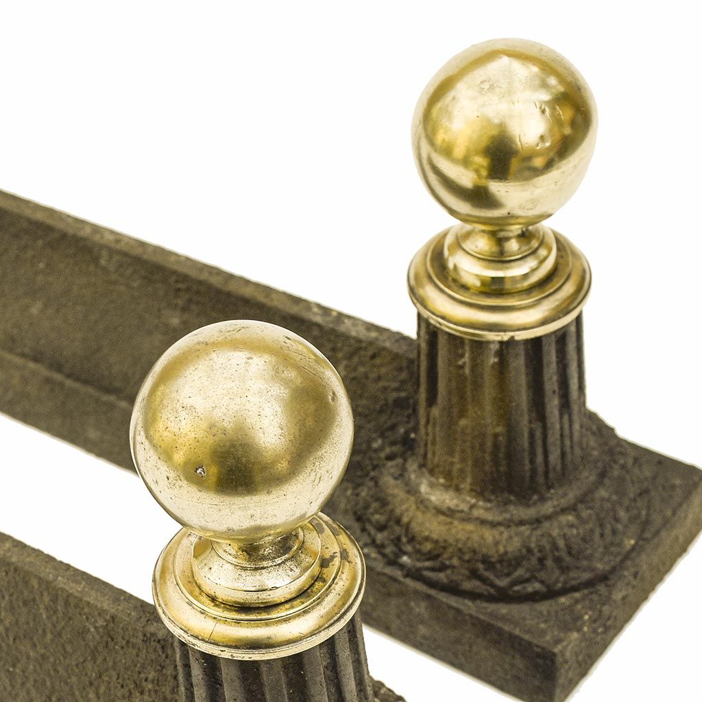 Pair of cast iron channels and brass ball 19th antique fireplace accessory