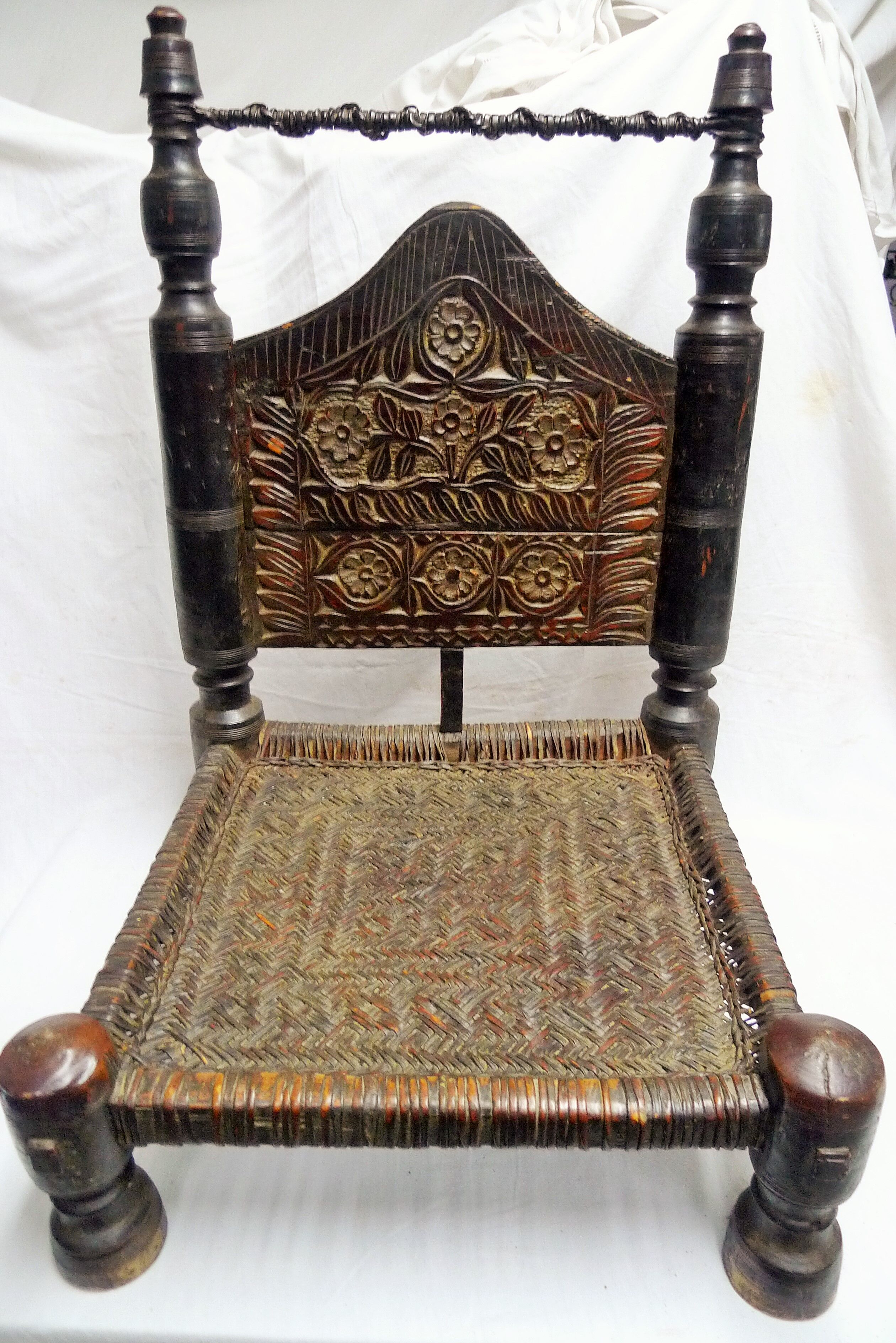 Traditional low chair in wood and leather