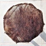 Rustic tripod stool seat covered with goatskin