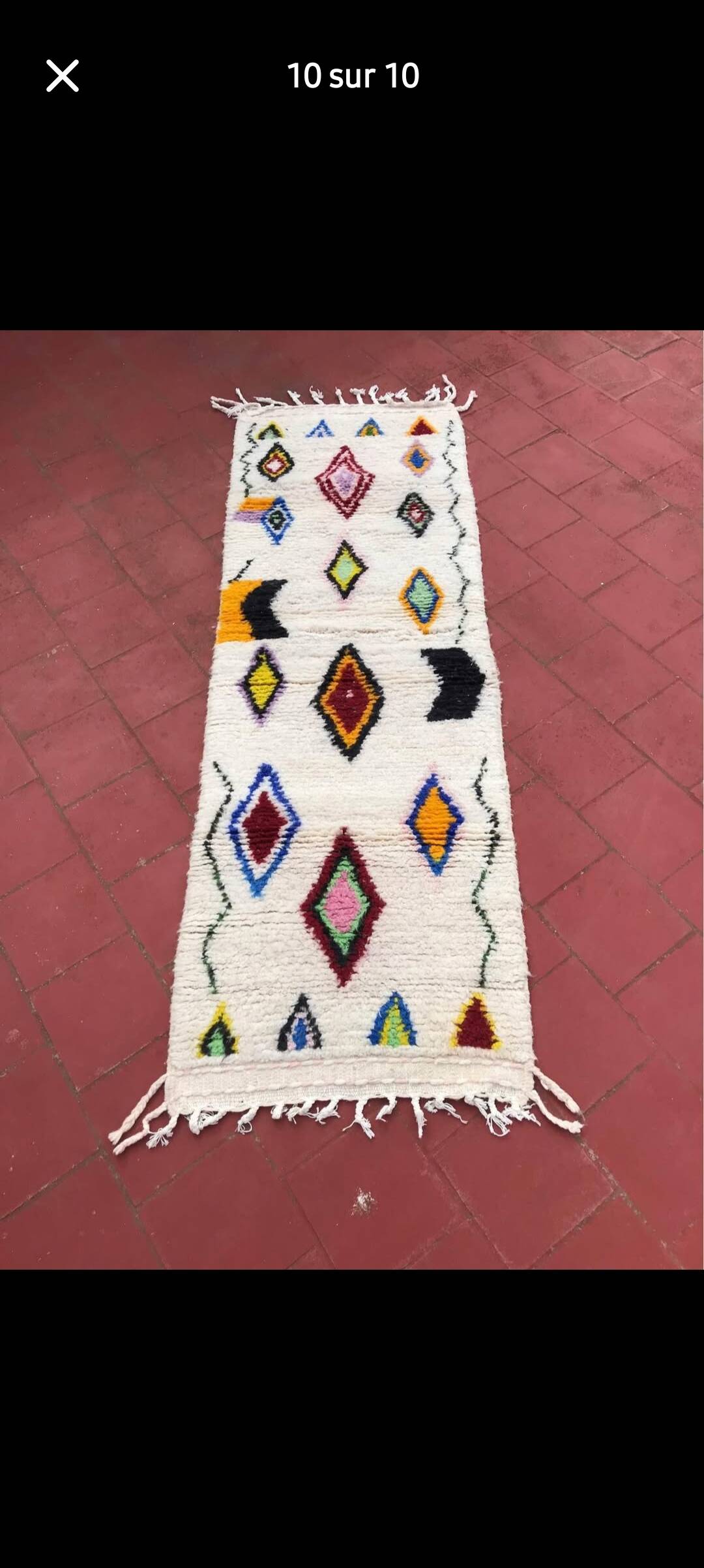 Colourful Moroccan rug made of natural wool. Woven by artisans.