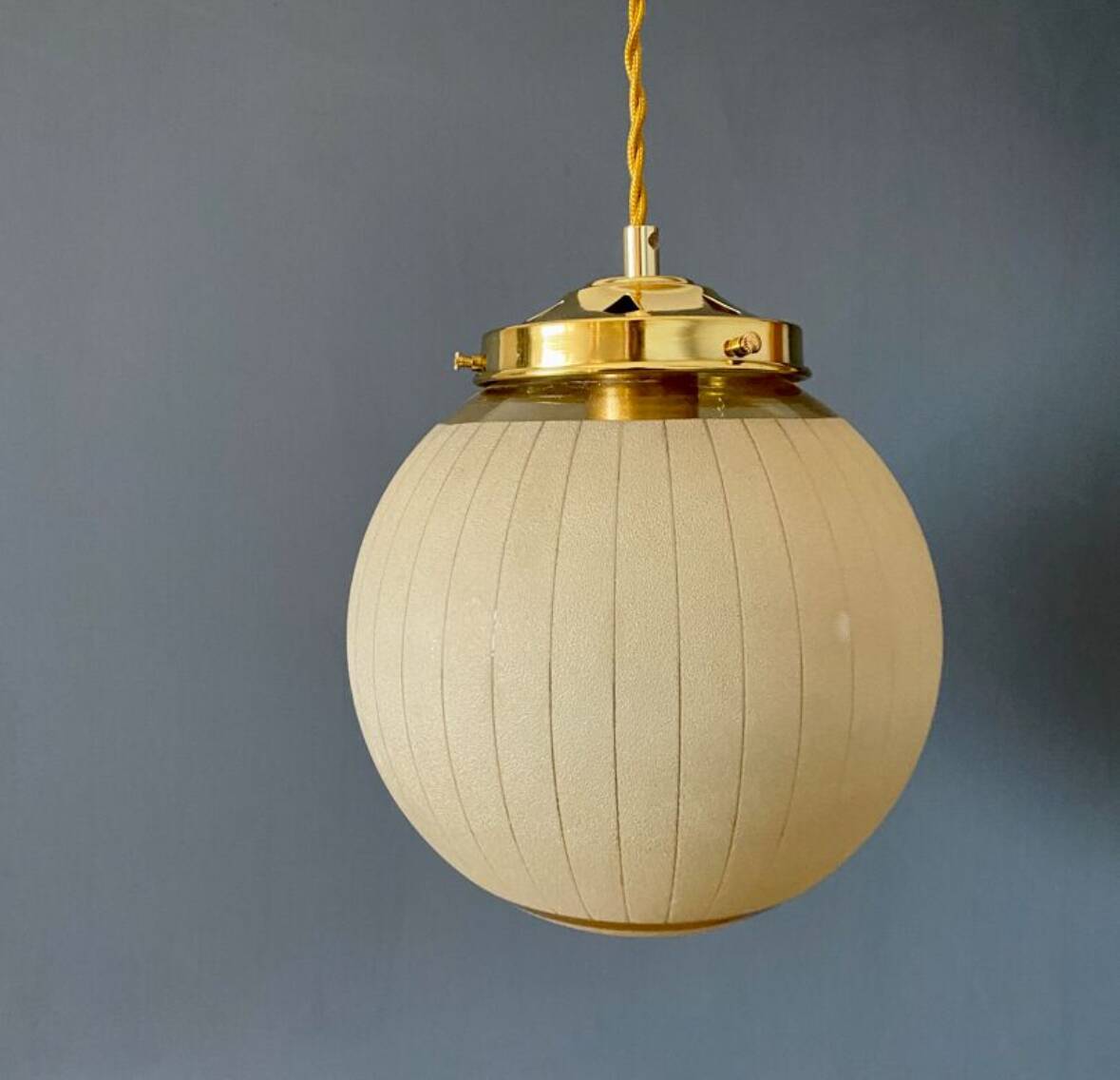 Vintage art deco globe pendant light in yellow and gold granite glass