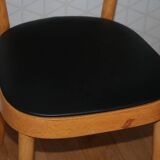 5 baumann chairs with large backs in black faux leather.