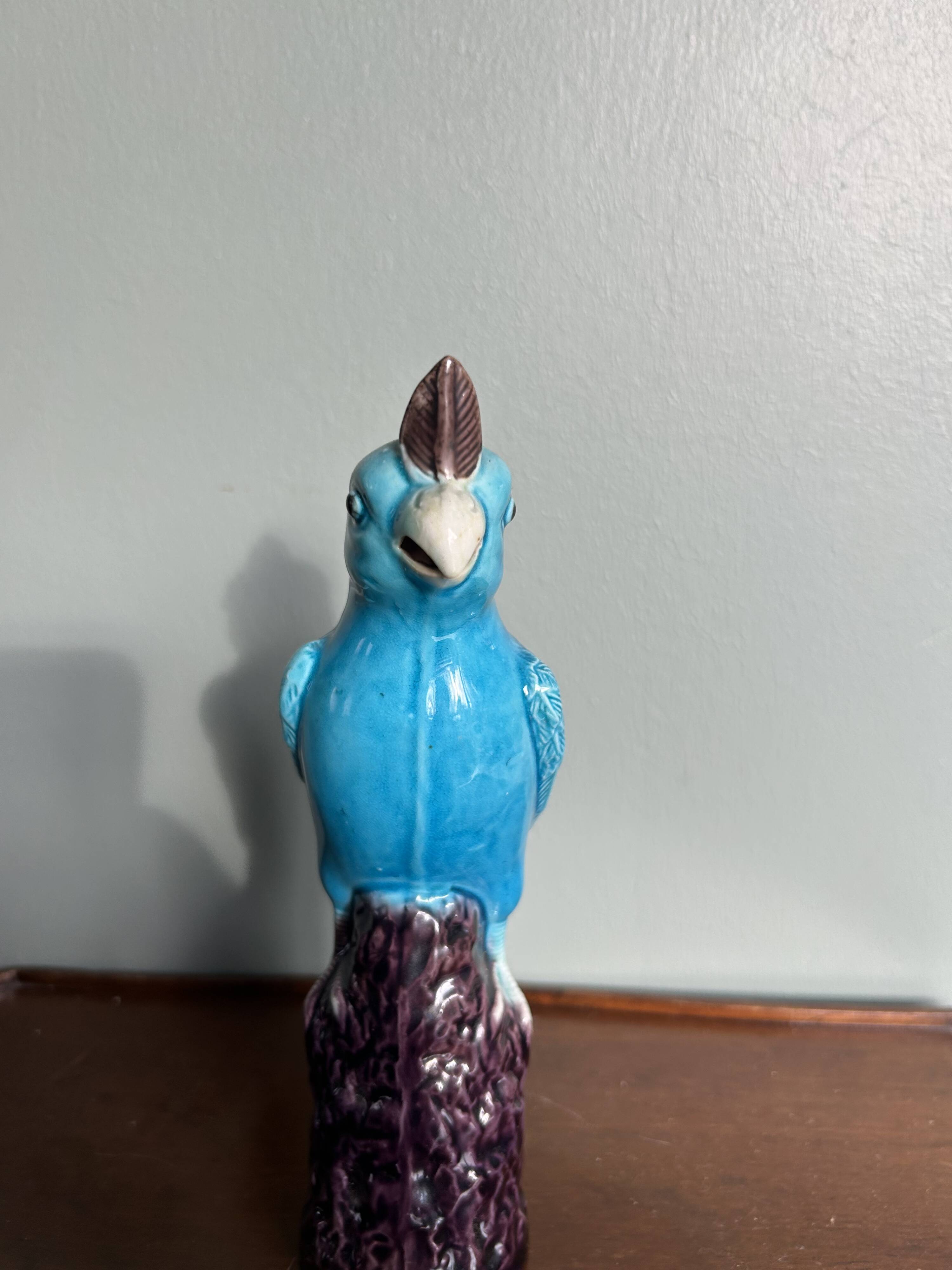 Porcelain parrot statuette