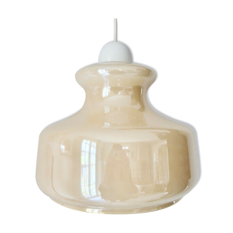 Pale yellow iridescent suspension