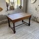 Paneled walnut desk with turned legs, 1900