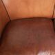 Sheepskin 2-seater sofa with a warm cognac brown colour scheme