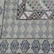 Traditional handmade Berber carpet in brown and beige wool.