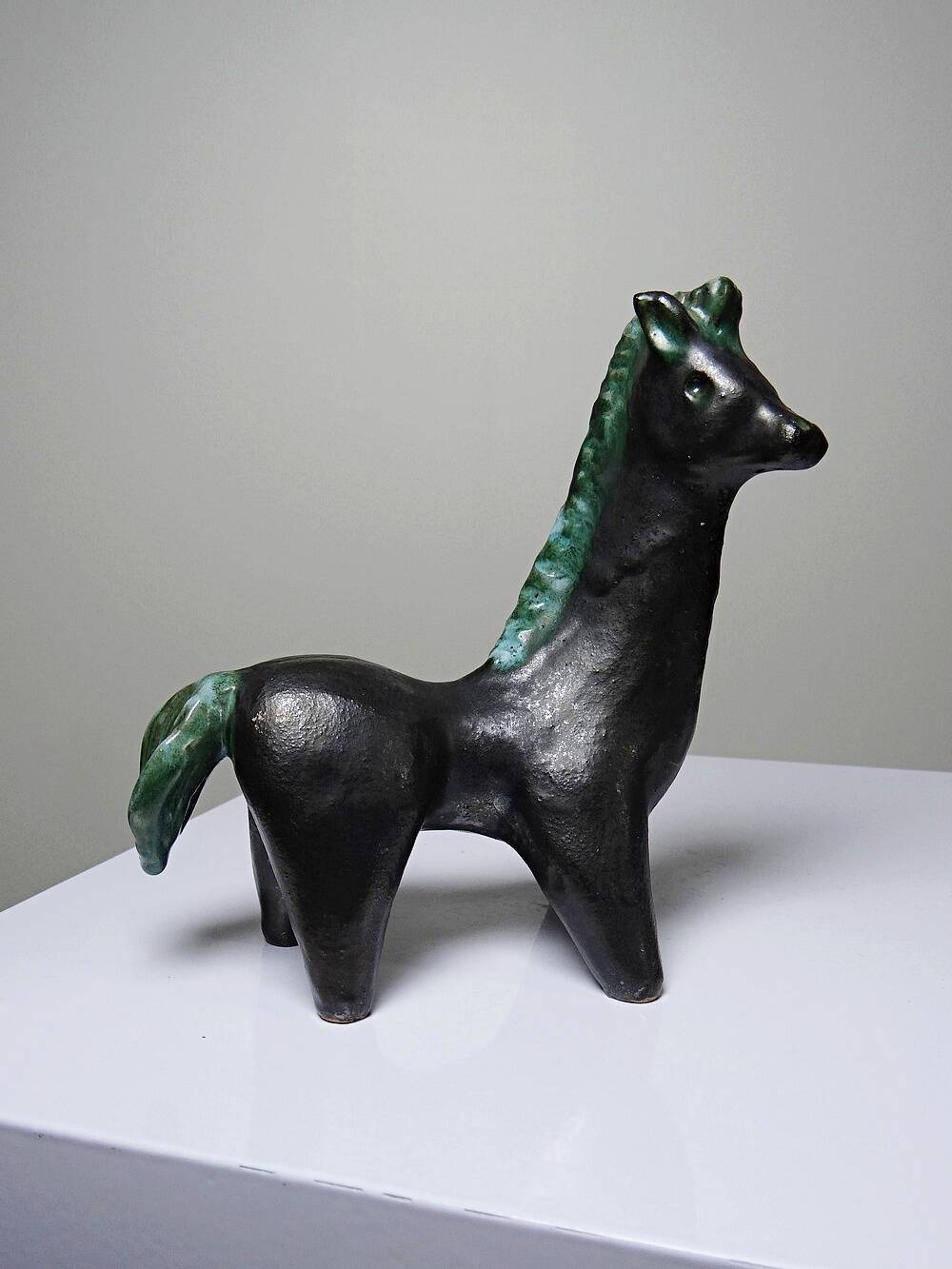Stylised vintage horse in black and green glazed clay, handcrafted.