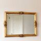 Vintage rectangular giltwood bevelled mirror with rose accents