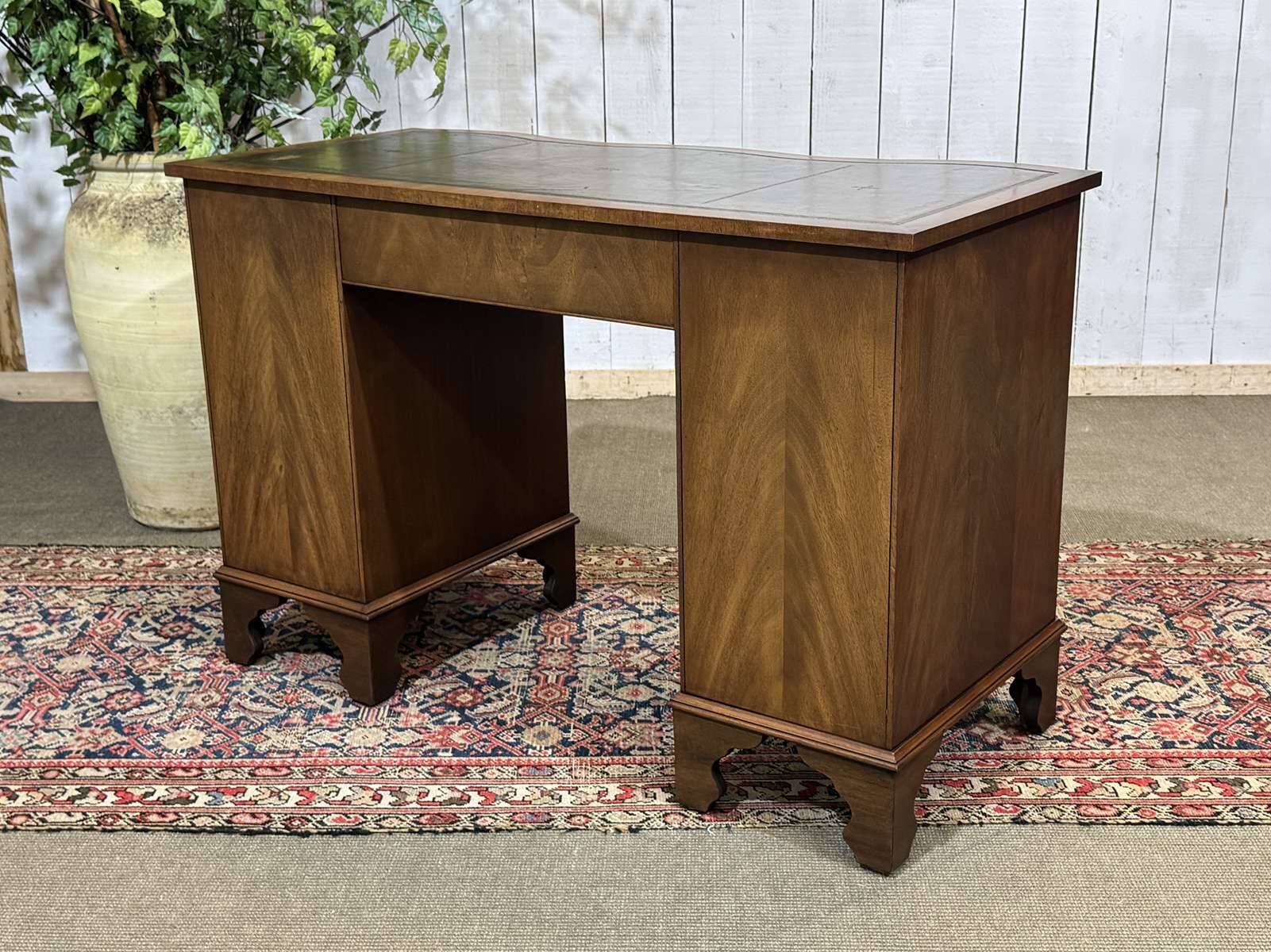 English desk from the 1950s in mahogany with a leather top.