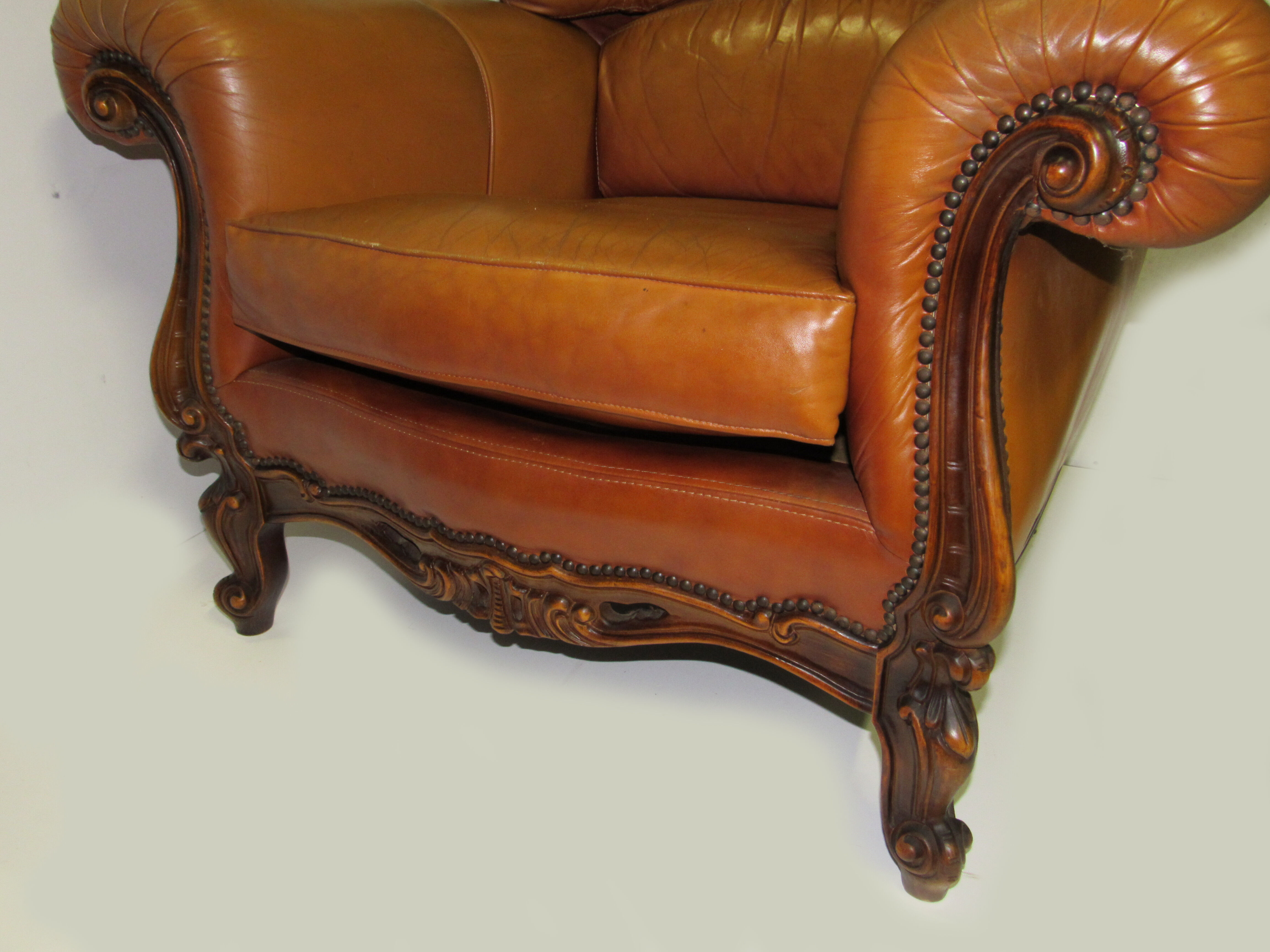 Louis XV style tawny leather chair