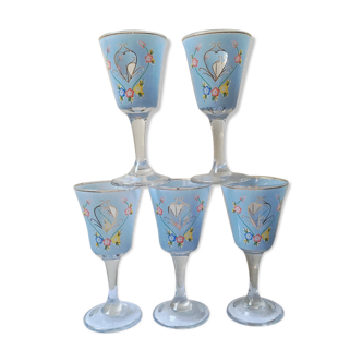 Set of 5 decorated glasses on foot