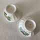 Pair of small faceted bowls with cow illustrations from the 40s and 50s