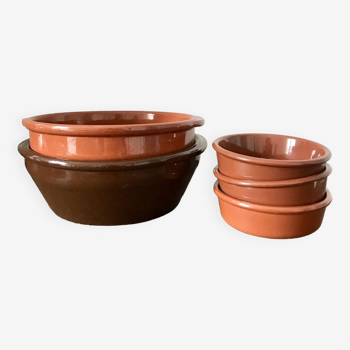 Set of glazed earthenware dishes and ramekins
