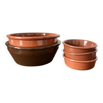 Set of glazed earthenware dishes and ramekins