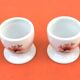 Ulysse Paris porcelain egg cup for Chanill with floral decoration.