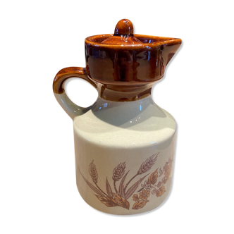 Beige and brown ceramic oil maker