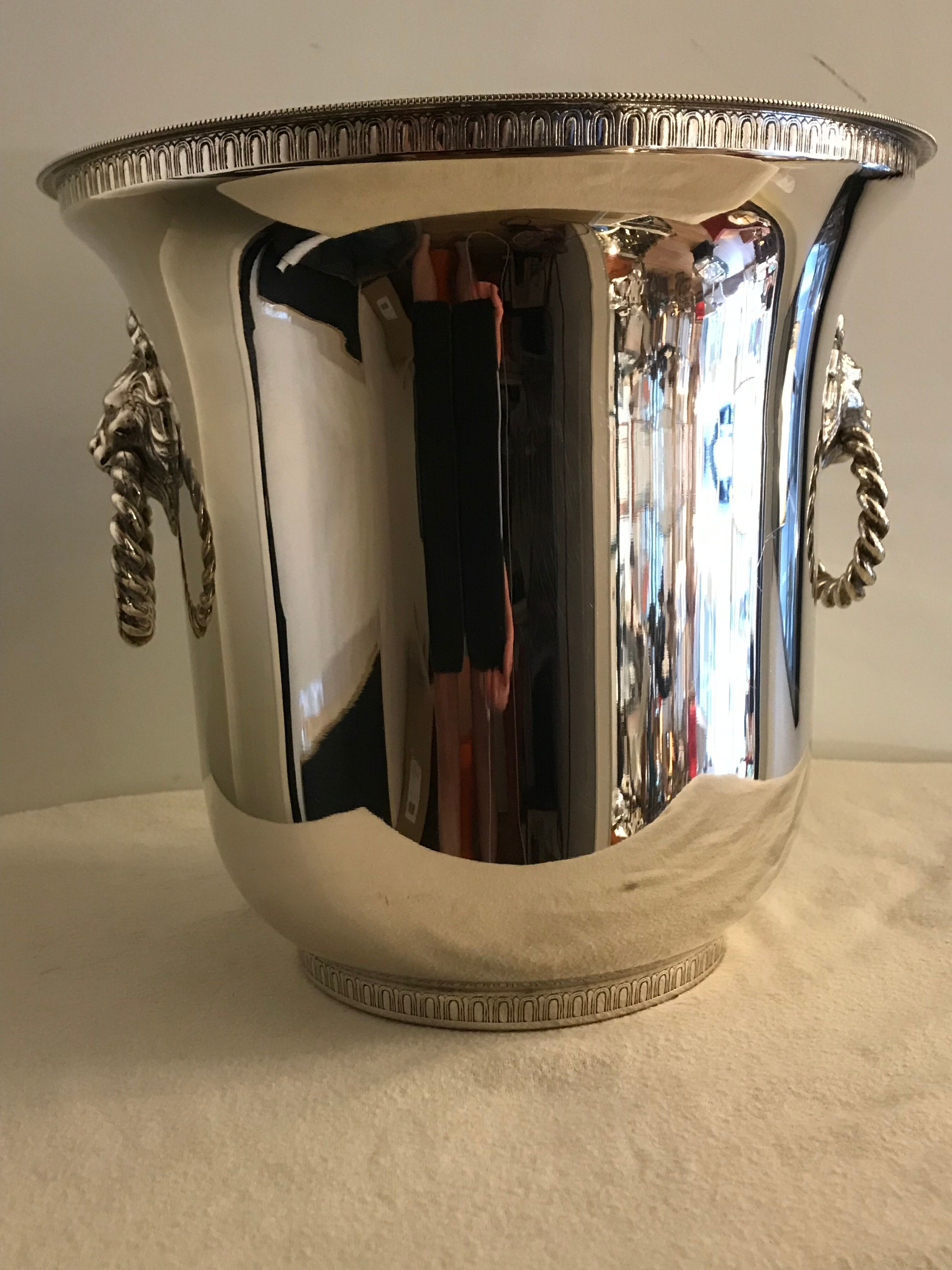 Ancient champagne bucket in silver metal with lion heads
