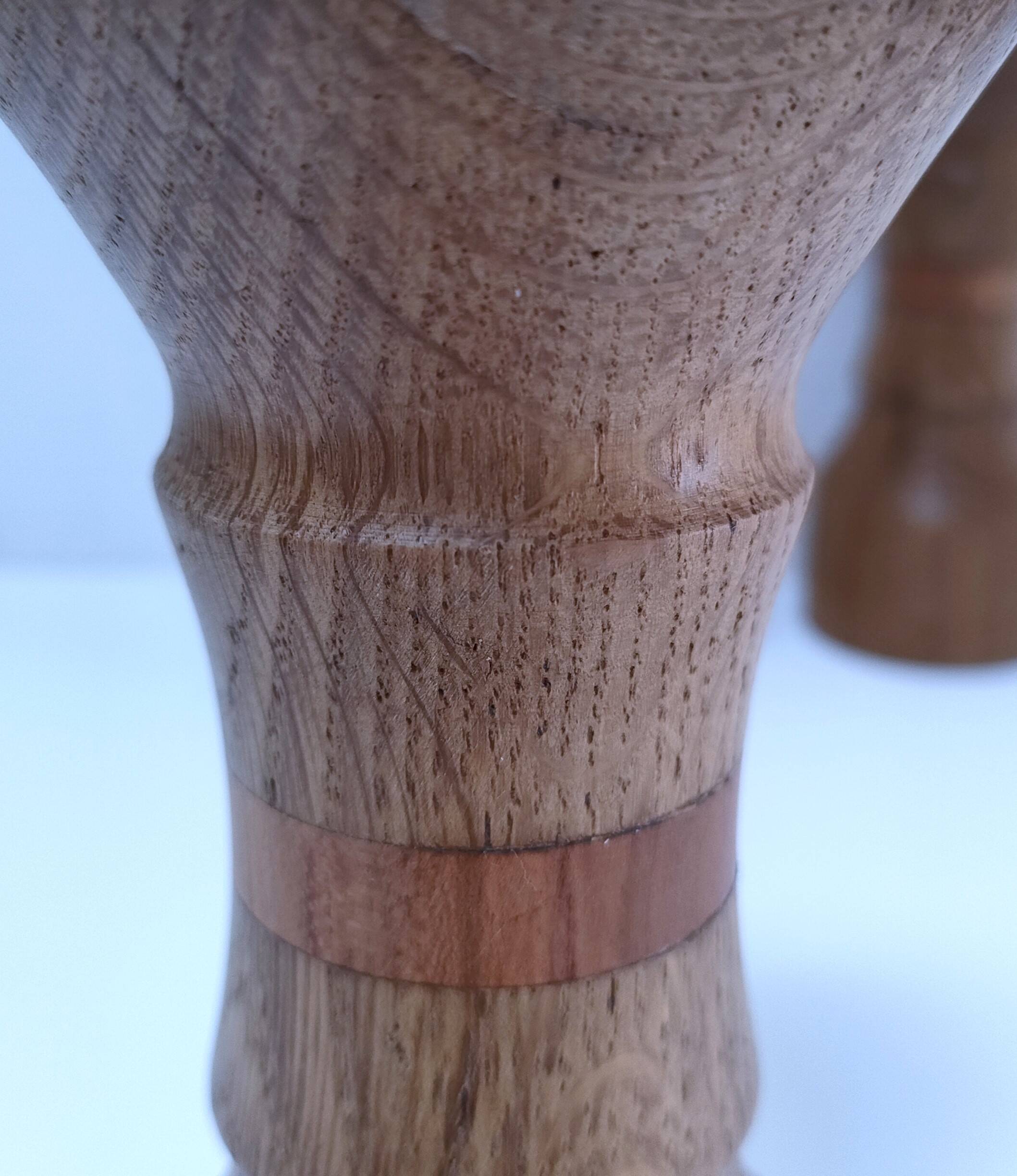 Three vintage patinated solid wood candlesticks