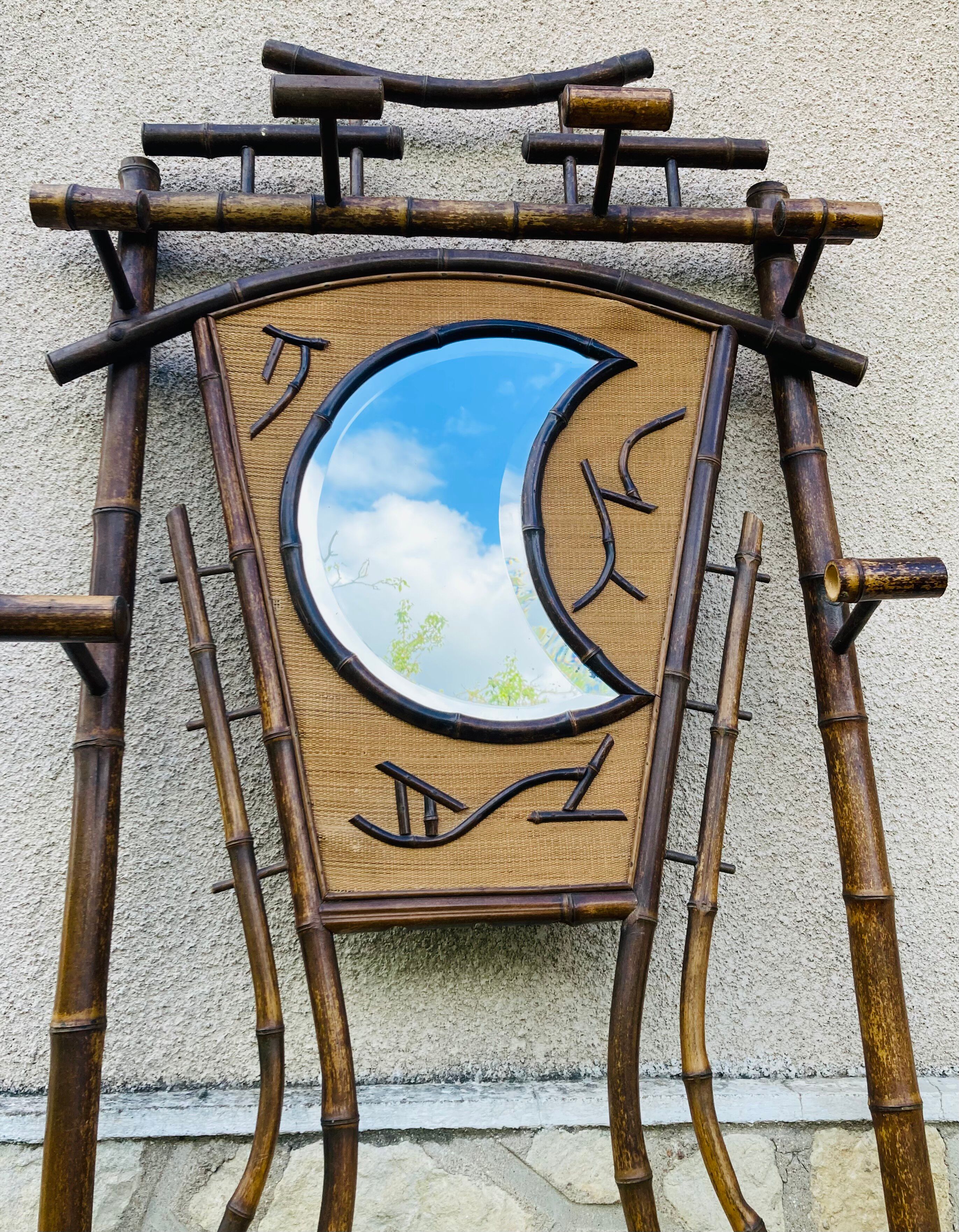 Bamboo coat rack from the 19th century, mirror in the shape of a crescent moon.