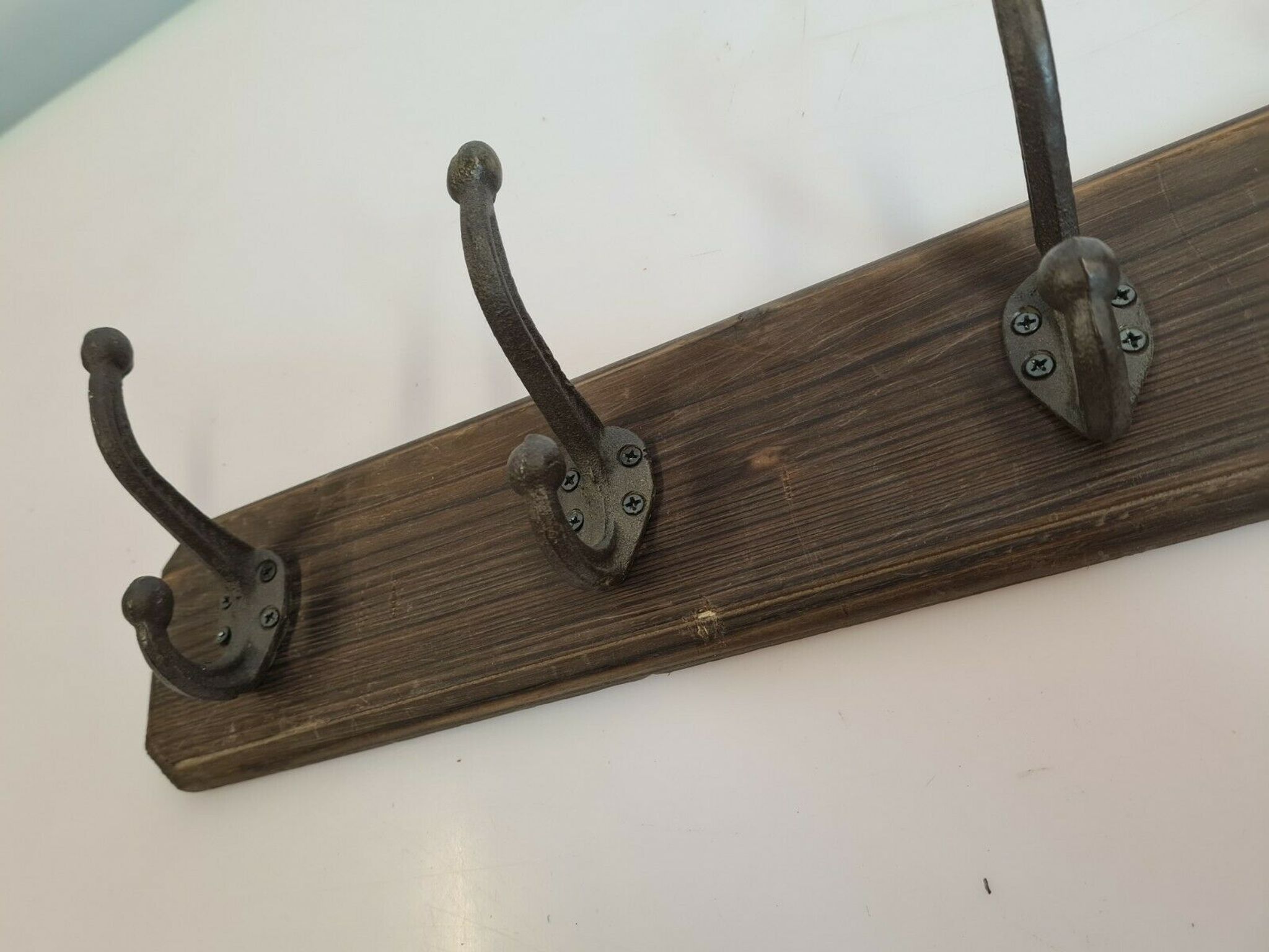 Wooden school coat rack with cast iron hooks