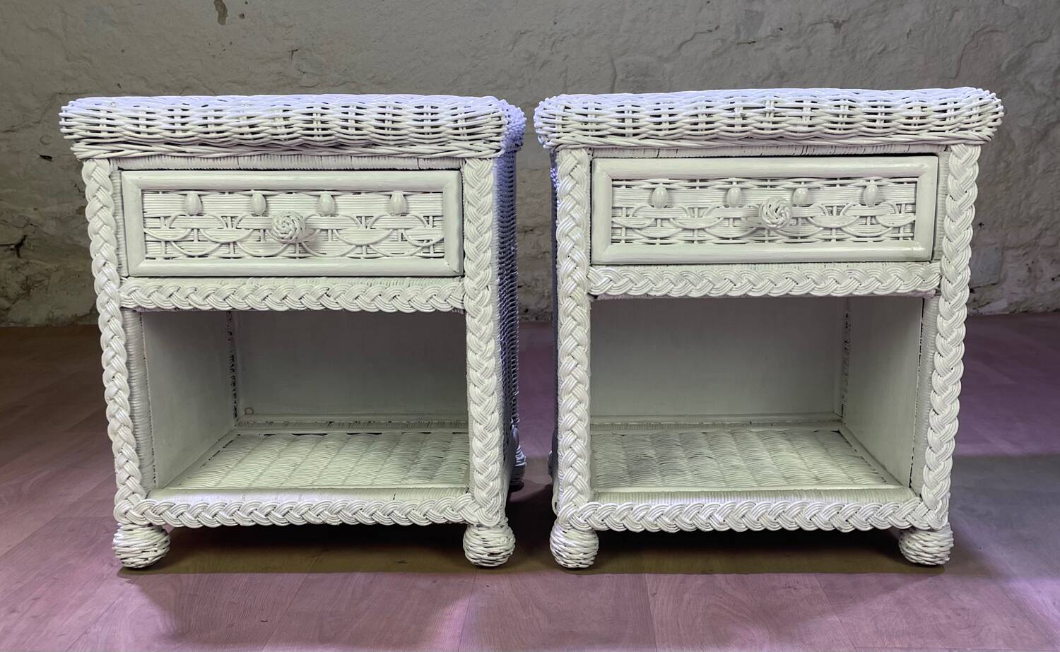 Pair of white lacquered rattan bedside tables