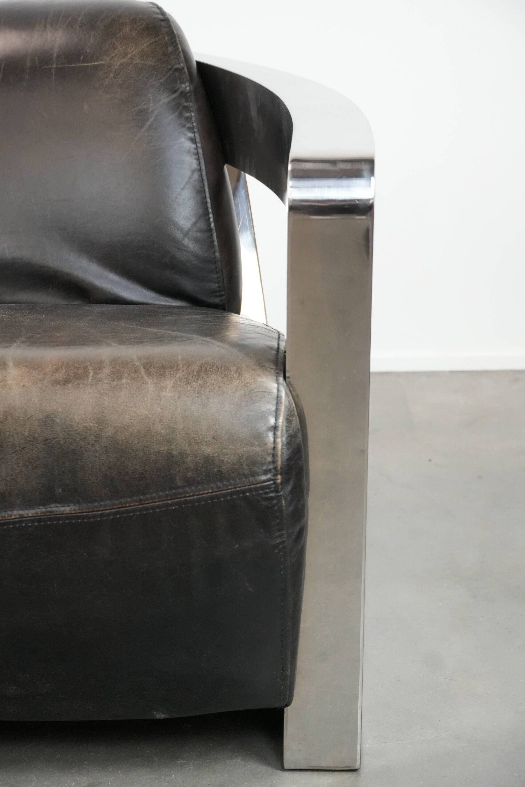 Set of two cowhide leather Aviator design armchairs with aluminium