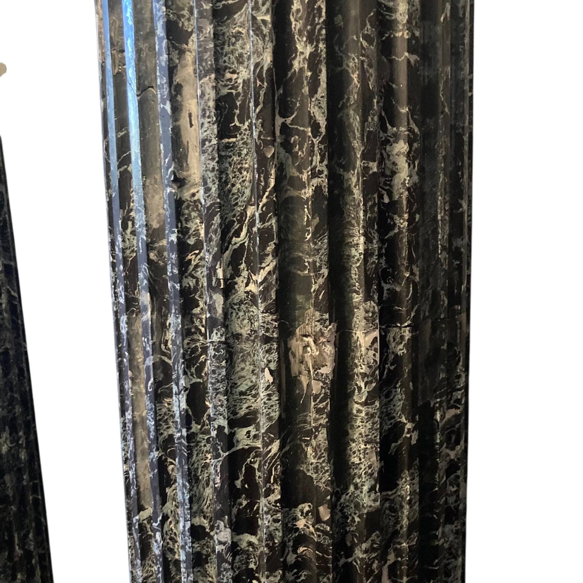 Pair of black and green scagliola columns from the 19th century.