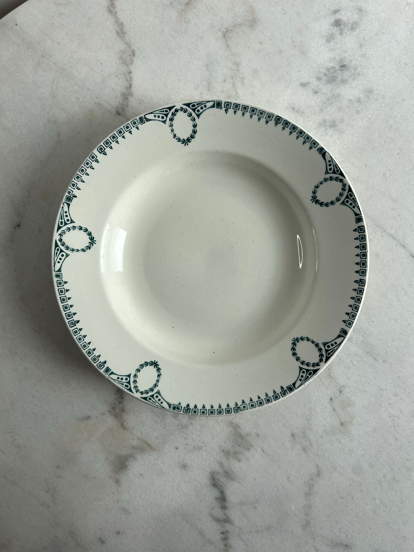 Set of 3 St Amand deep plates with green crown decoration.