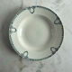 Set of 3 St Amand deep plates with green crown decoration.