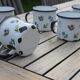 Enamelled sheet metal cups