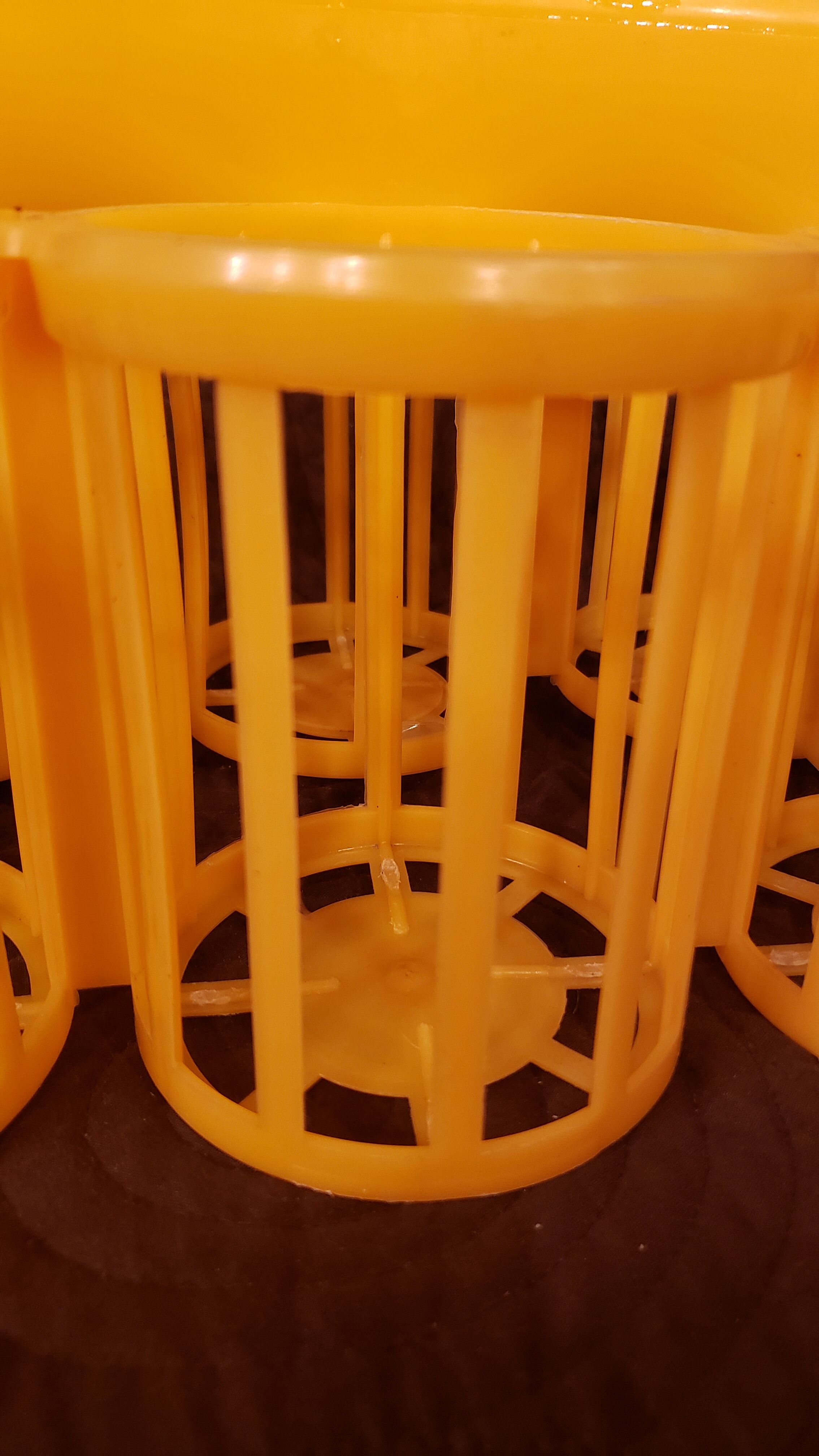 Vintage yellow plastic bottle holder