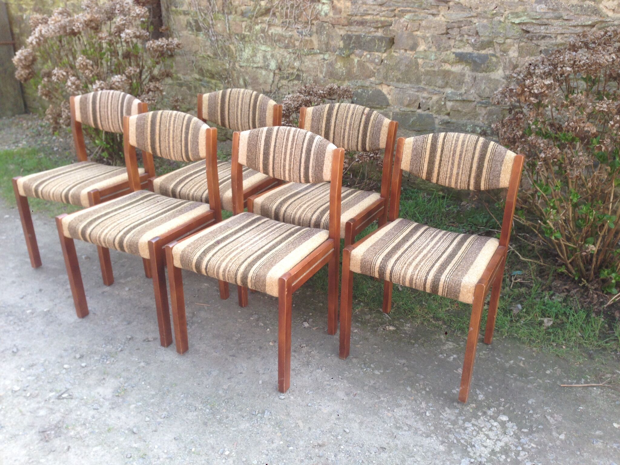 Vintage Scandinavian chairs in fabric and wooden footing.