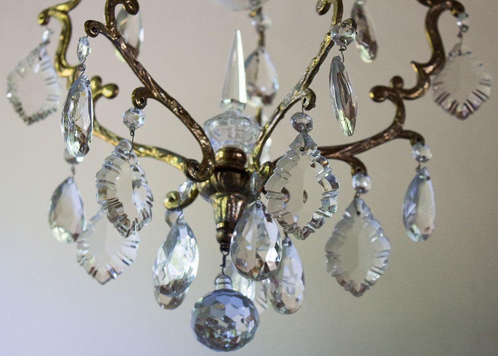 Old brass chandelier with glass stamps