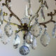 Old brass chandelier with glass stamps