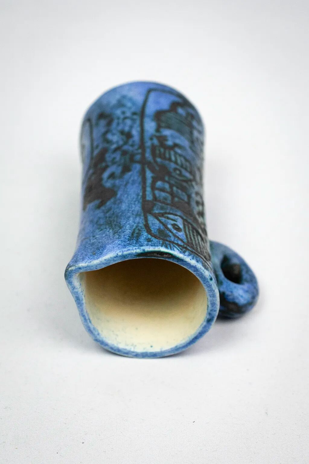 Small jug by Jacques Blin in blue ceramic with engraved animal decoration.