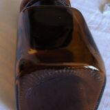 Vintage amber orange glass bottle