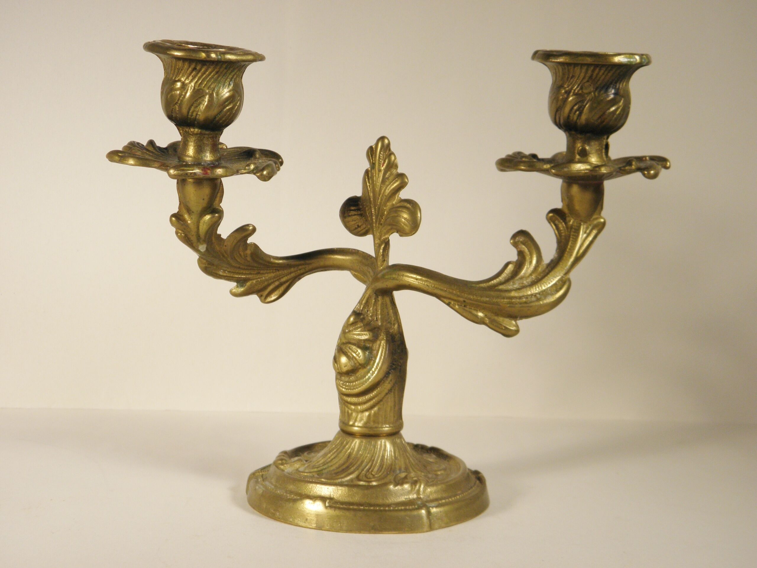Two-branched candlestick in gilded bronze
