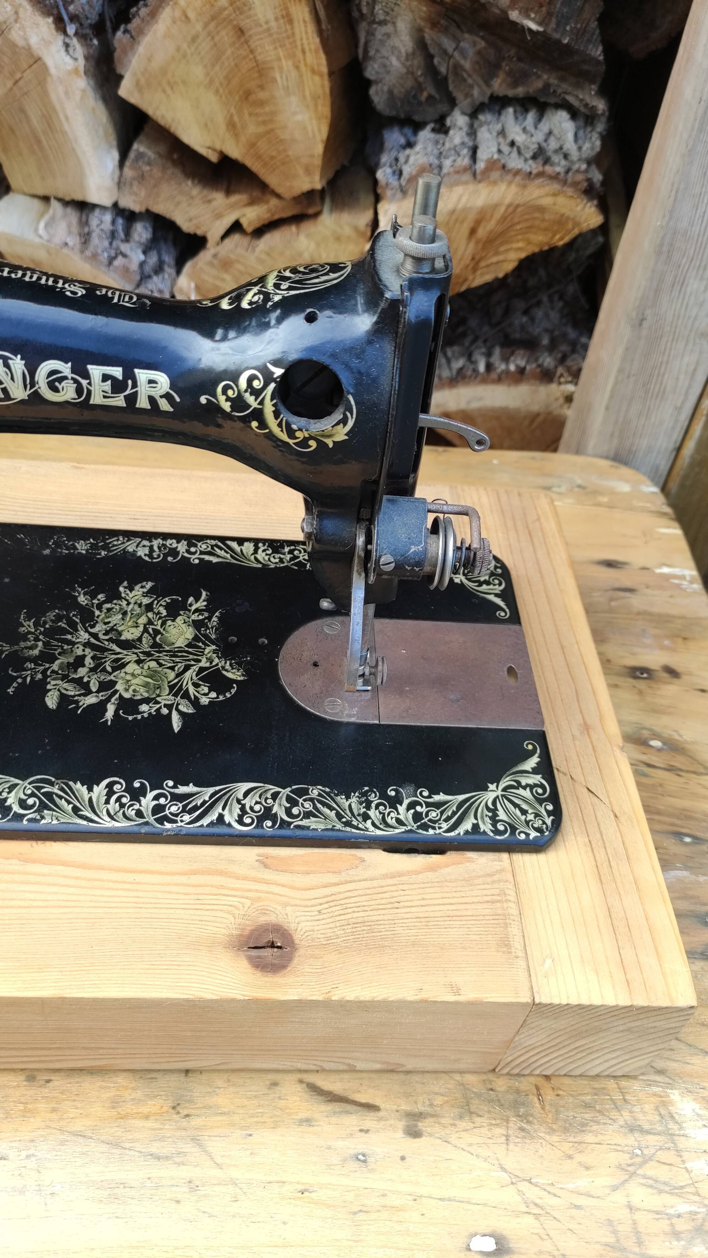 Old Singer sewing machine on pedestal