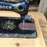 Old Singer sewing machine on pedestal