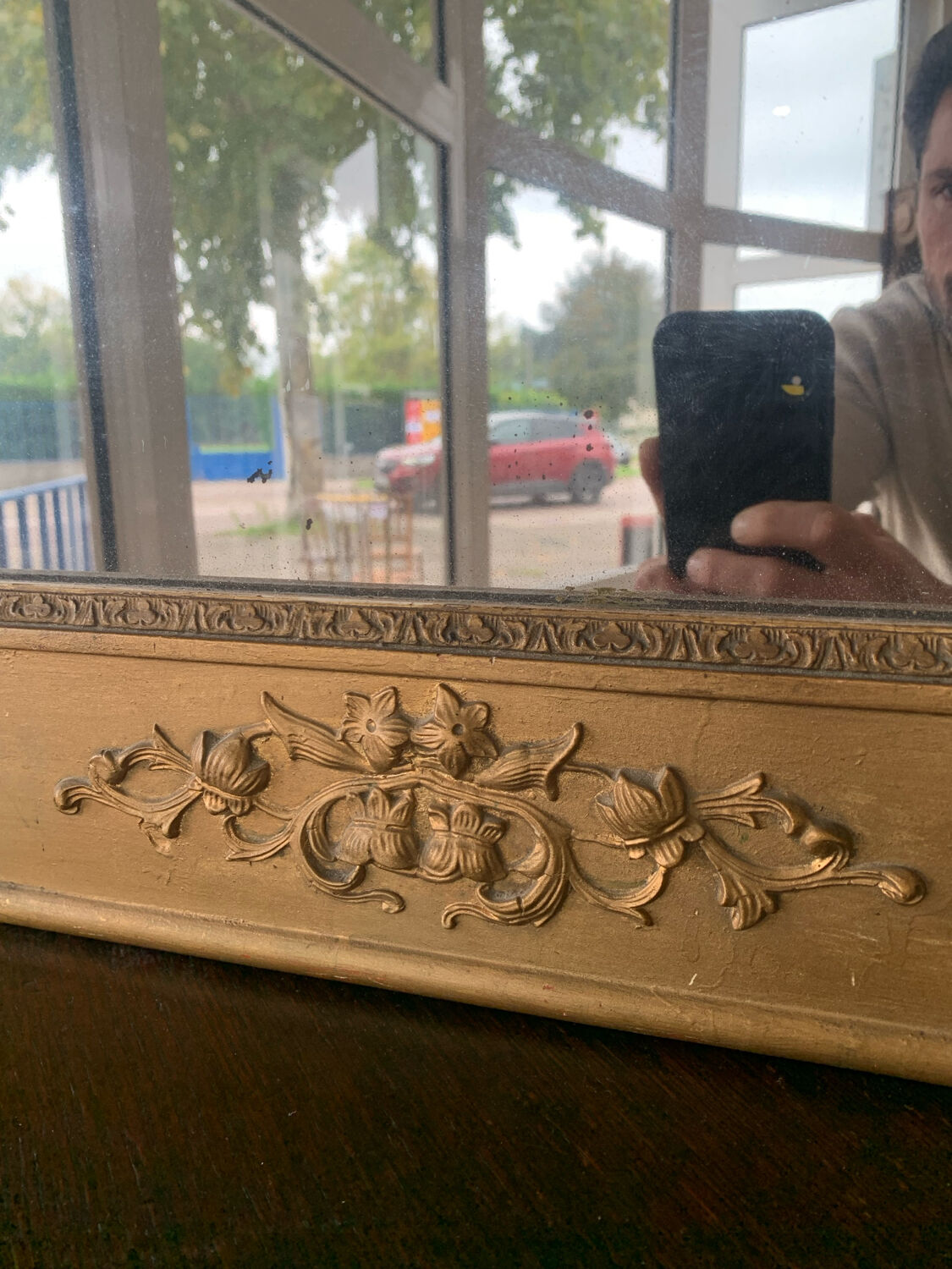 Old gilded mirror fireplace, 19th century restoration