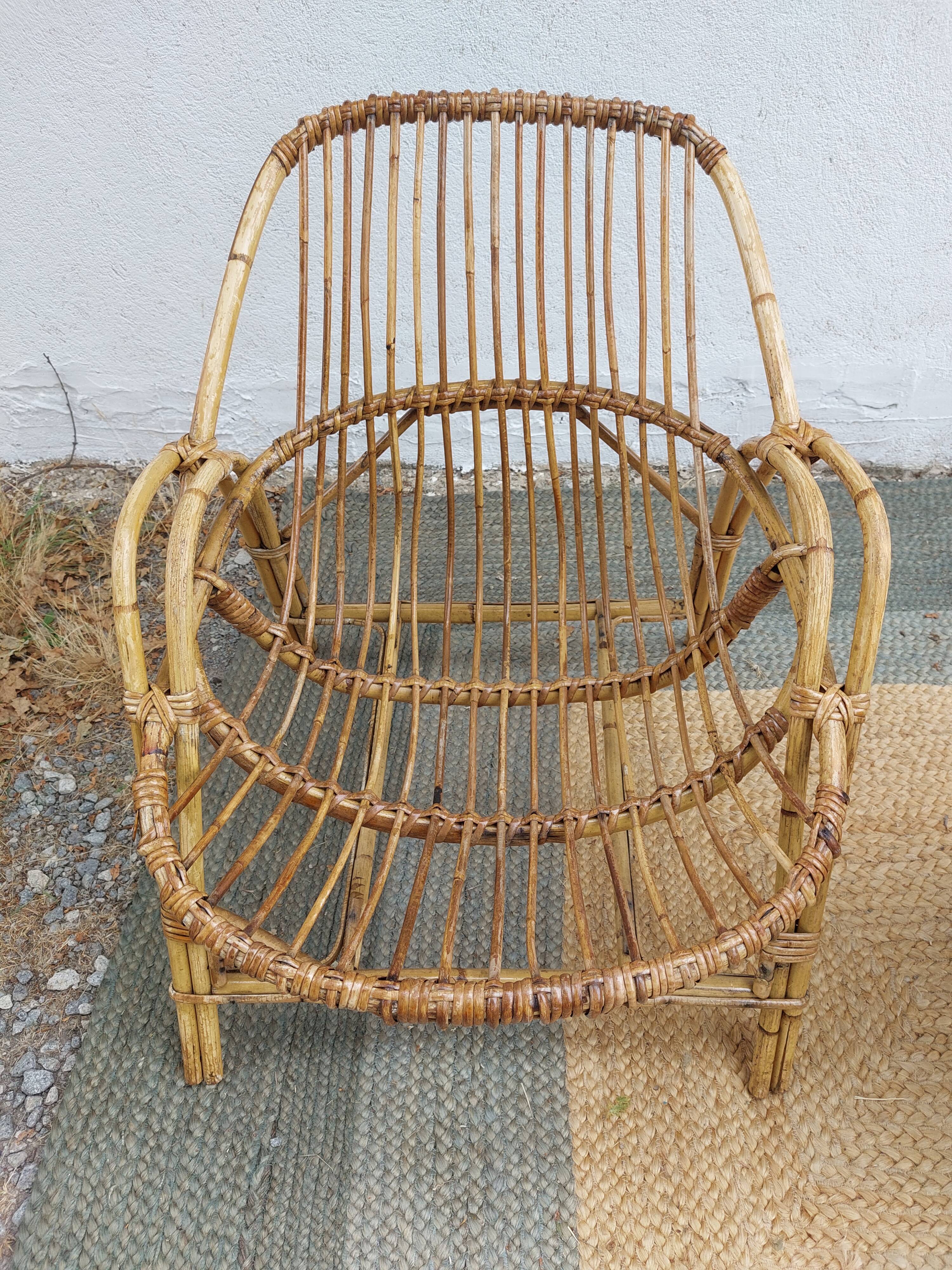 4 armchairs and a coffee table made of rattan and bamboo wood, vintage.